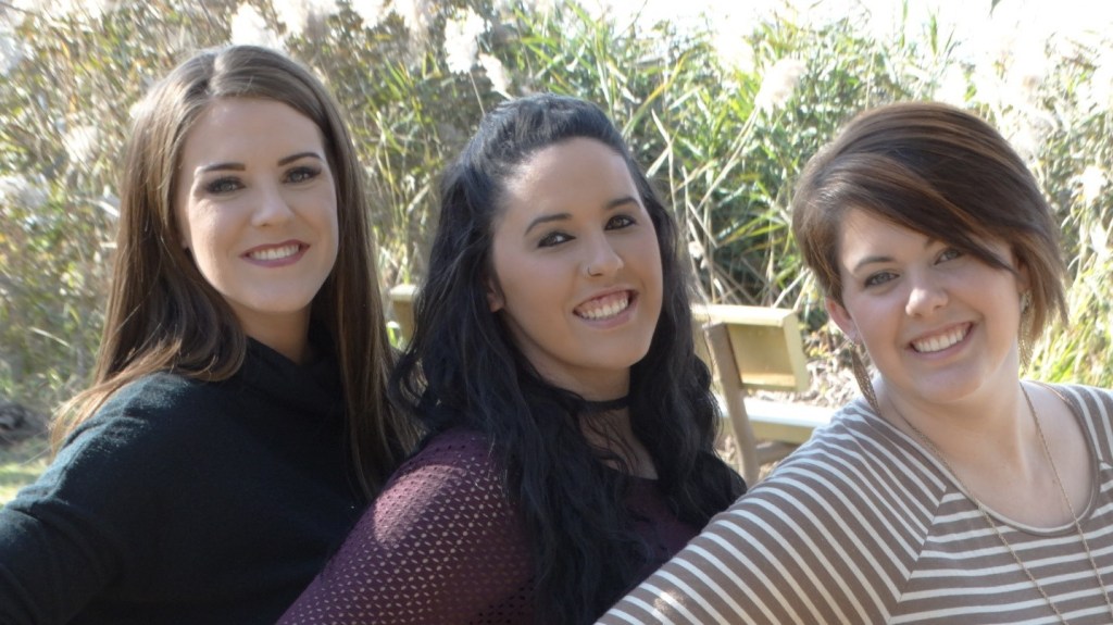 A group of people posing for the camera

Description automatically generated